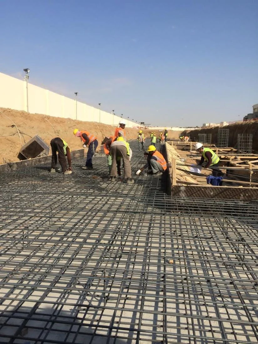 HAM site crew placing concrete over reinforcement